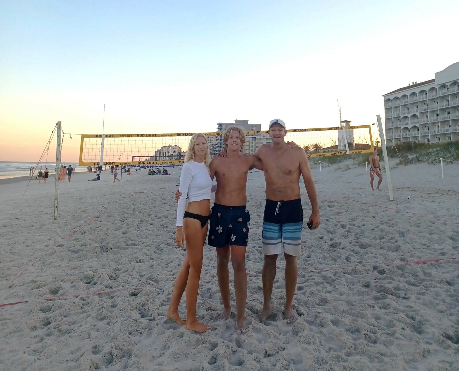 A proud family moment. Vanessa Summers-Gyulai, left, congratulates son Thor Gyulai-Summers and her husband, Andor Gyulai, right, after the father-son pair won the championship game in a recent AA Jacksonville Beach volleyball tournament. At ages 16 and 47, Thor and Andor represented the youngest and oldest players in the tournament, going undefeated in every game through the championship.